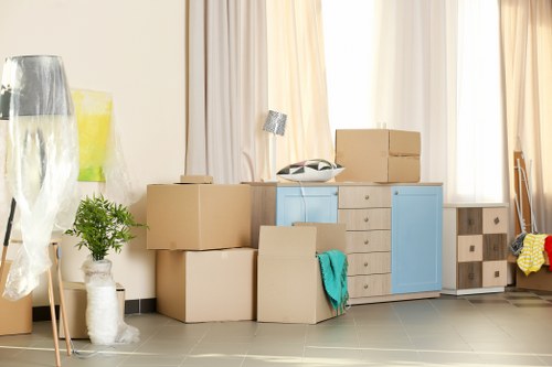 Removal team handling furniture in North Sheen