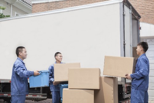 Moving team handling a sofa near North Sheen residential streets