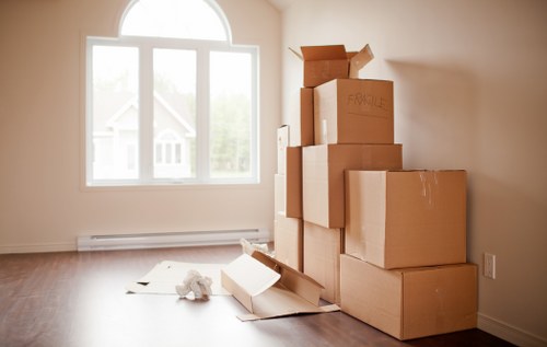 Staff loading furniture safely into a moving van