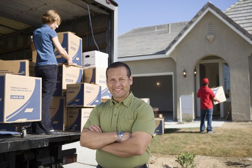 Moving team preparing a home relocation in North Sheen
