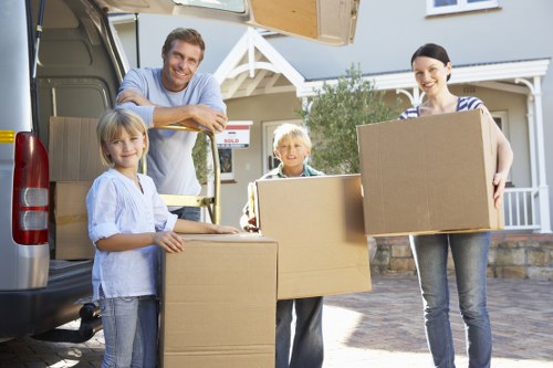 Unpacking and organising boxes in a new North Sheen home
