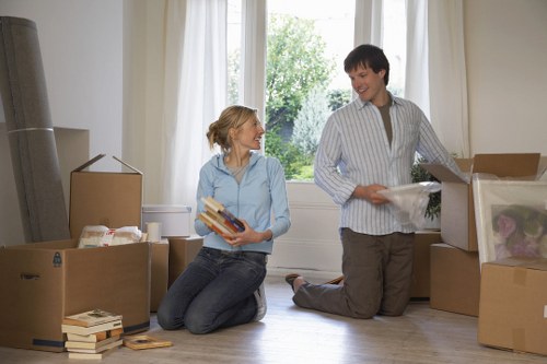 Loading furniture into a removal truck in North Sheen