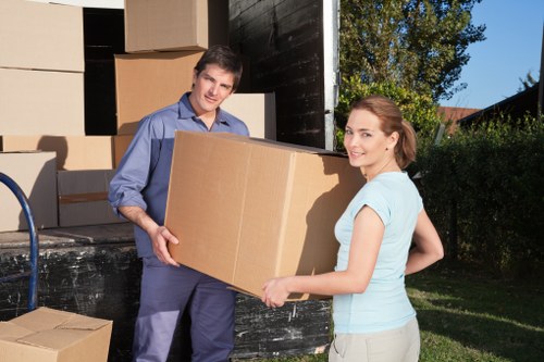 Packed boxes and furniture prepared for a local removal in North Sheen